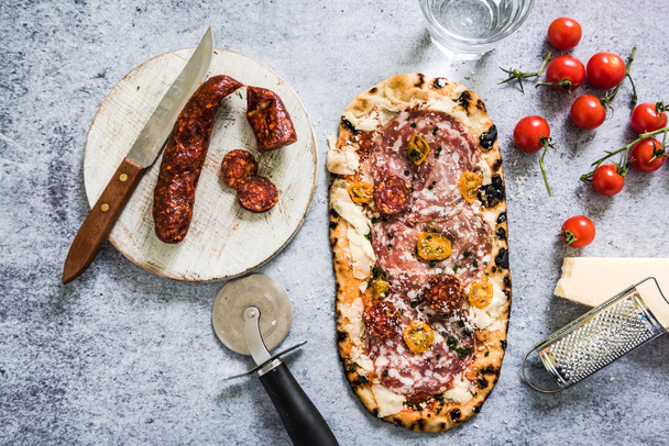 artisan baked pizza with ingredients - Photo, Image