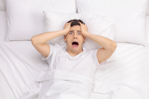 Frustrated man unable to get some sleep   - Foto, Bild