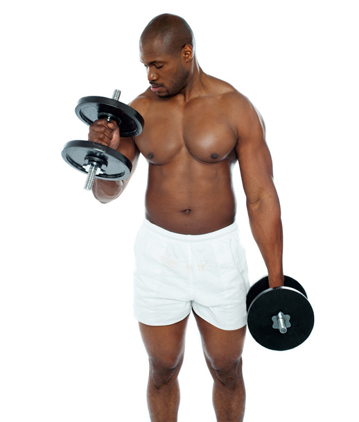 Young african man doing biceps exercise - Foto, Imagem