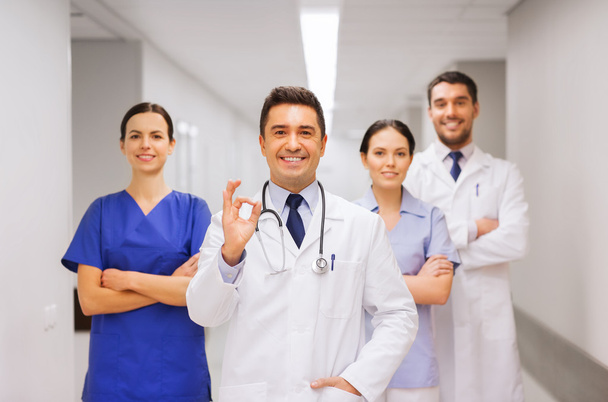 group of medics at hospital showing ok hand sign - Фото, зображення