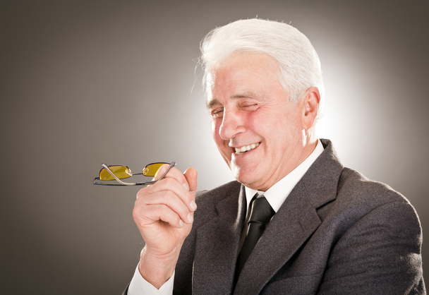 Senior businessman portrait with glasses isolated on grey - Foto, Imagem