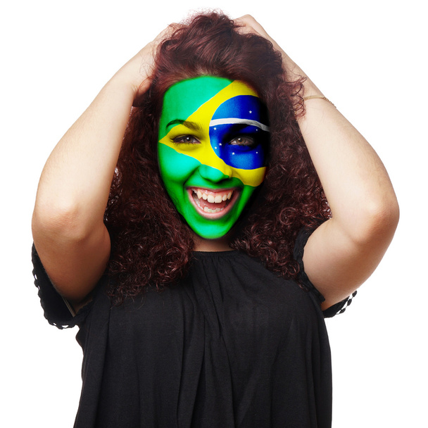 ブラジル国旗のフェイス ペイントの女の子 - 写真・画像