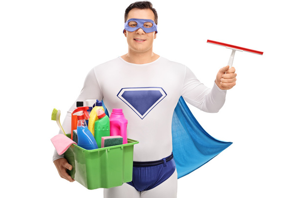 Superhero holding cleaning equipment  - Foto, Bild