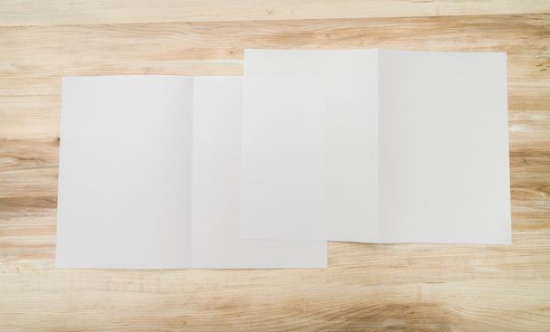 Bifold white template paper on wood texture - Foto, immagini