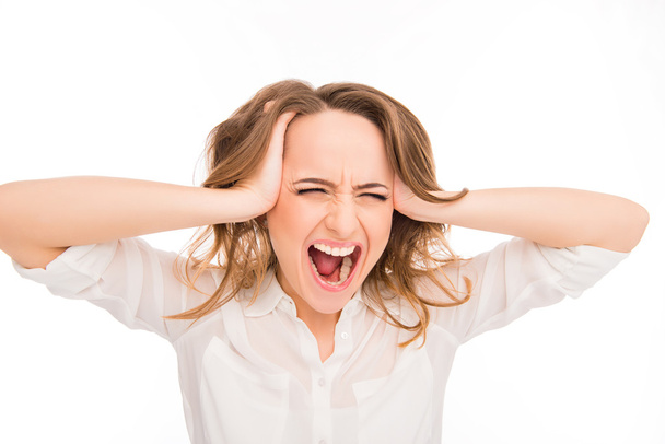 Portrait of very frustrated and angry young woman screaming - Фото, изображение