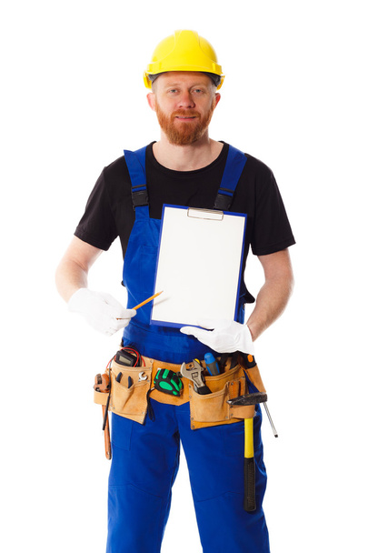 Man builder in the uniform with clipboard - Photo, Image