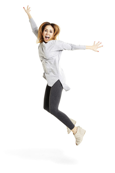 Young Woman Jumping - Foto, afbeelding