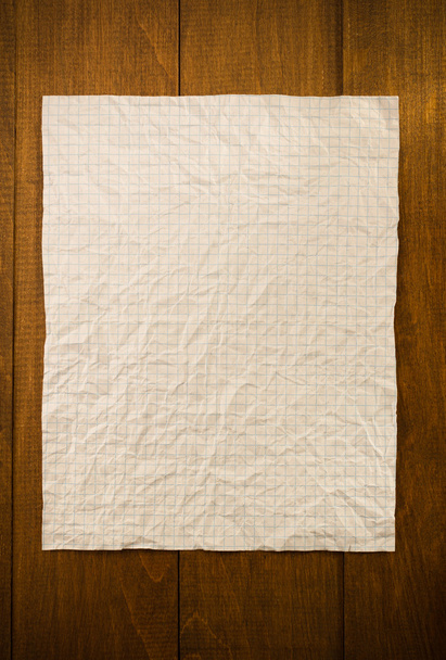 wrinkled note paper on wood - Fotoğraf, Görsel