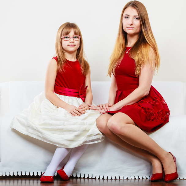 Mother and daughter posing together - 写真・画像