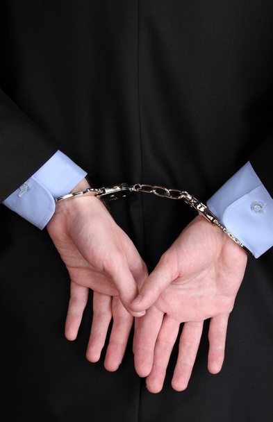 Businessman hands fettered with handcuffs - Foto, afbeelding