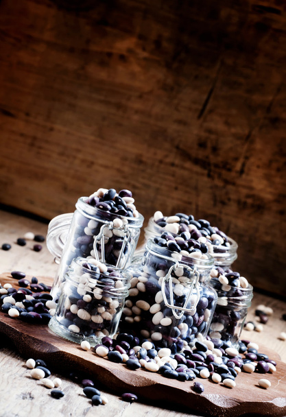 multi-colored dry beans in glass jars - 写真・画像
