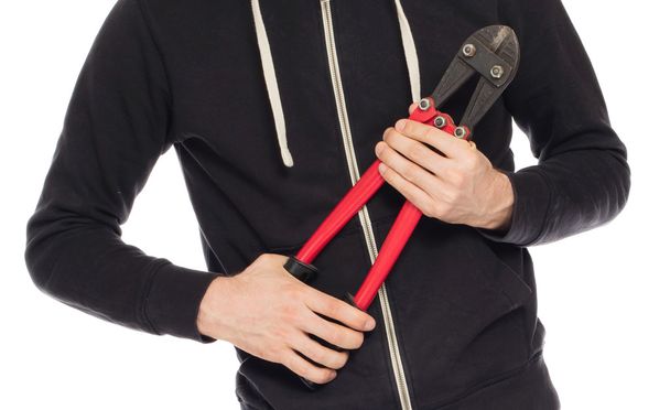 Robber with red bolt cutters - Foto, imagen