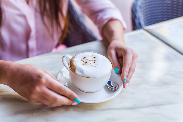 Cappuccino cup in the girl hands. Breakfast - Fotó, kép