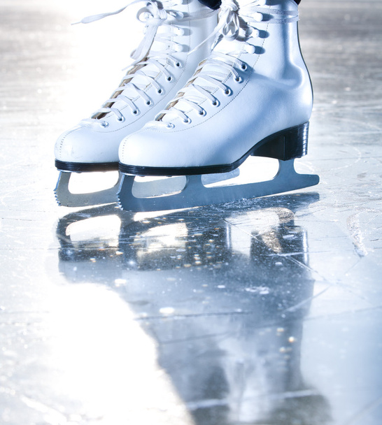 Dramatic blue portrait shot of ice skates - Photo, Image