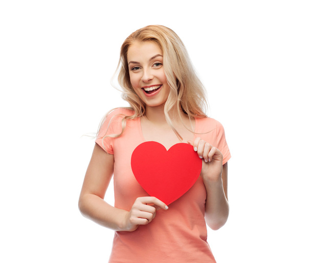 happy woman or teen girl with red heart shape - Fotó, kép