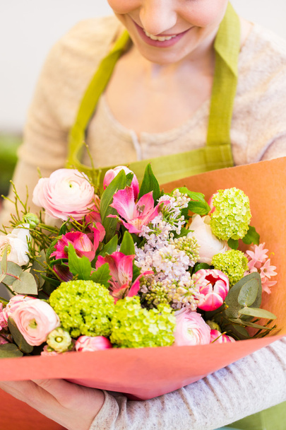 close up of woman with bunch at flower shop - Zdjęcie, obraz