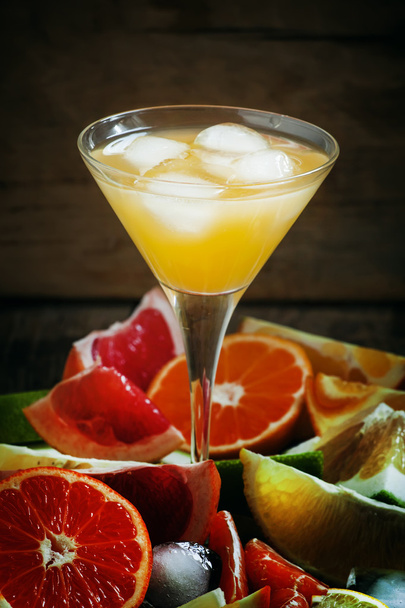 Citrus cocktail with ice and slices of fruits  - Fotoğraf, Görsel