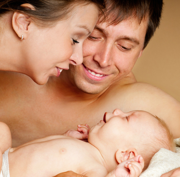 Happy young family with baby - Фото, изображение