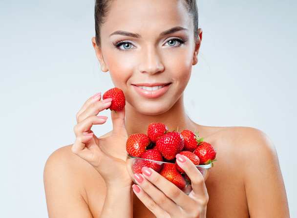 cheerful girl with strawberries - 写真・画像