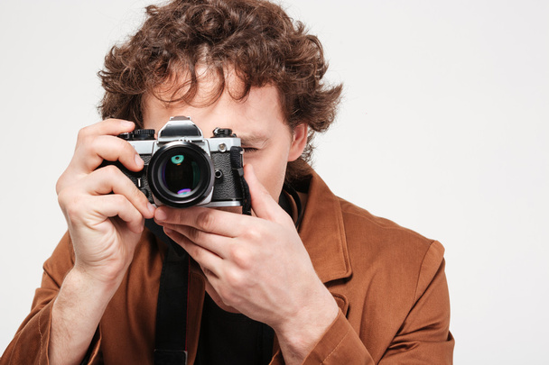 Man photographing on retro camera  - Photo, image