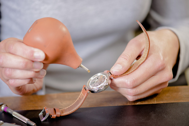 Female watch repair expert - Фото, изображение