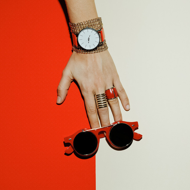 Stylish Accessories. Focus on red. Watches, sunglasses, rings. - Φωτογραφία, εικόνα