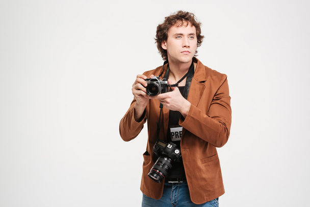 Male reporter holding camera - Foto, Imagen