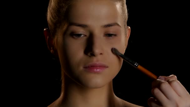 Makeup. Cosmetics. Makeup artist at work - Felvétel, videó