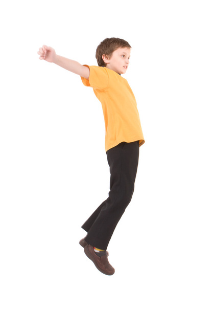 Young boy jumping up - Foto, afbeelding