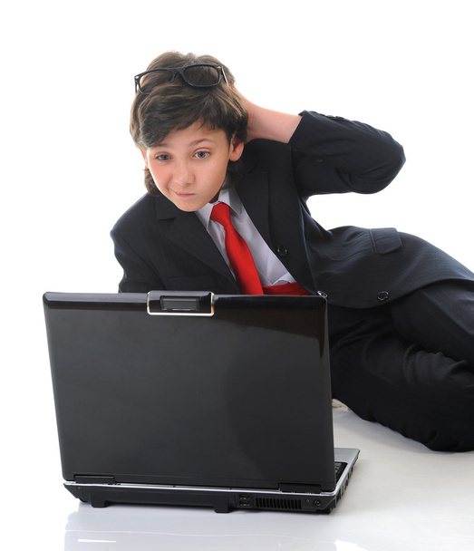 Boy in business suit sitting in front of computer - Foto, Imagen
