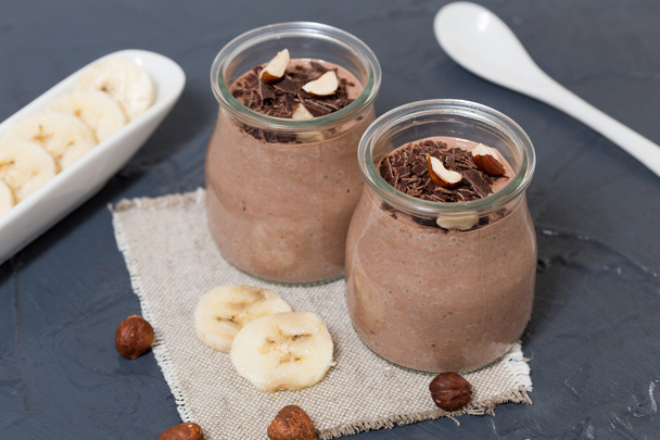 Chocolate pudding with chia seed, bananas and nuts,  in a glass  - Photo, Image