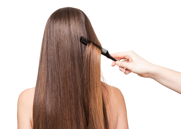 Girl long smooth hair brush, closeup isolated on white background - Φωτογραφία, εικόνα