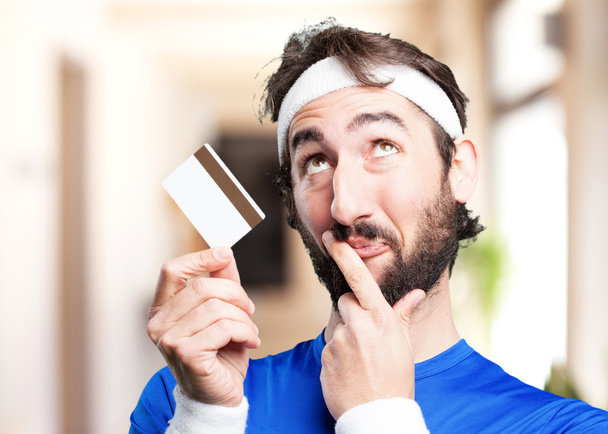 crazy sports man with credit card - Foto, Imagem