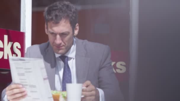 Businessman having lunch at cafe - Footage, Video