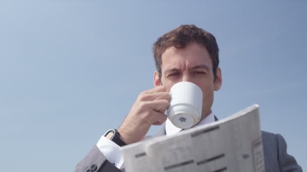 Businessman drinking coffee - Кадри, відео
