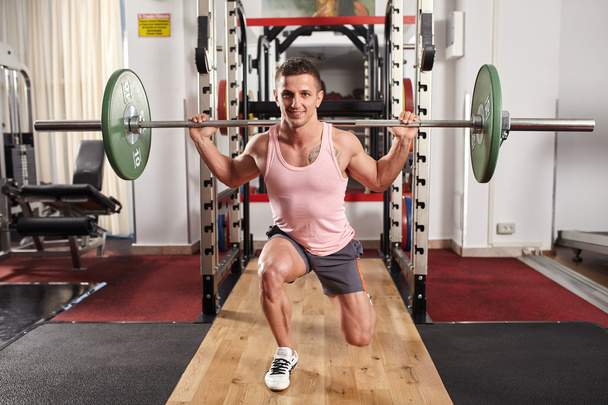 Man doing barbell lunges - Photo, Image