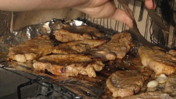Hand Using Tongs For Turning Meat on the Grill. - Footage, Video
