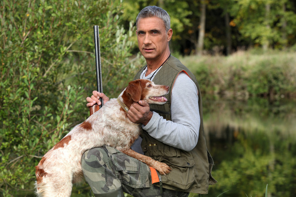 Hunter with dog - Фото, изображение