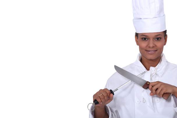 Woman with a kitchen knife - Foto, imagen