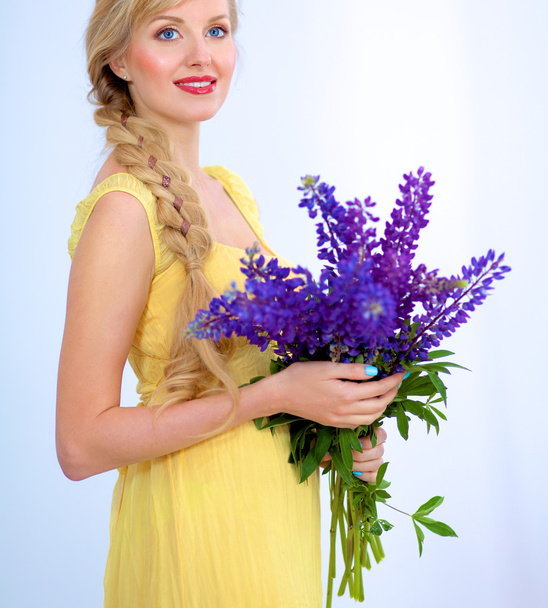 Young woman with beautiful hairstyle and flowers - Φωτογραφία, εικόνα