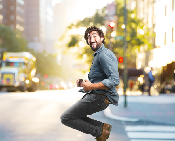crazy man jumping with happy expression - Foto, Imagen