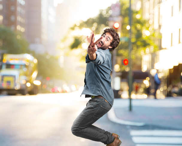 crazy jumping man with happy expression - Foto, Imagen