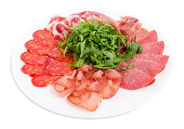 Delicious meat platter with arugula. - Foto, imagen