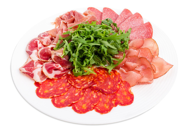 Delicious meat platter with arugula. - Foto, Imagen