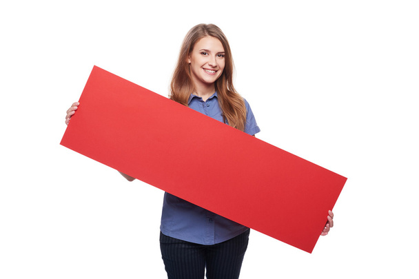 Woman holding red blank cardboard - Foto, Imagen