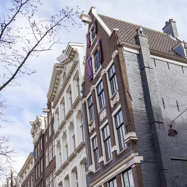 AMSTERDAM, NETHERLANDS on MARCH 27, 2016. Typical architectural details of houses XVII-XVIII of construction - 写真・画像
