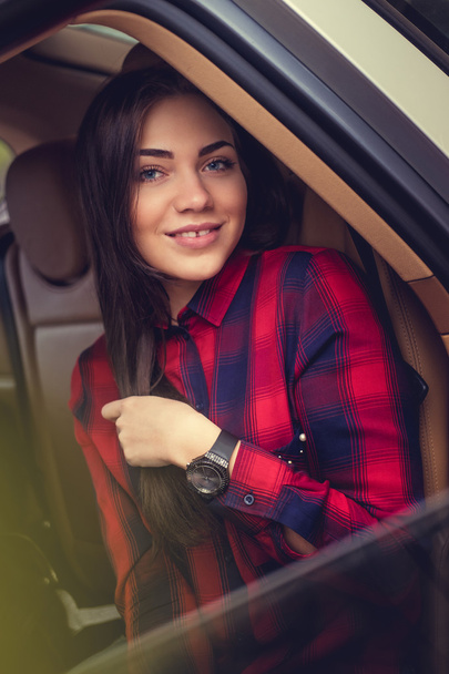 Brunette woman in a car - Photo, Image