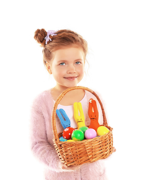 Little girl sitting with Easter eggs - Foto, afbeelding