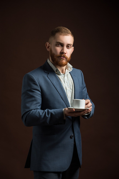 Elegant bearded man with cup of coffee - Fotografie, Obrázek