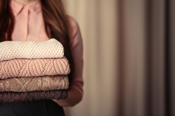 Stack of knitted clothes   - Фото, зображення